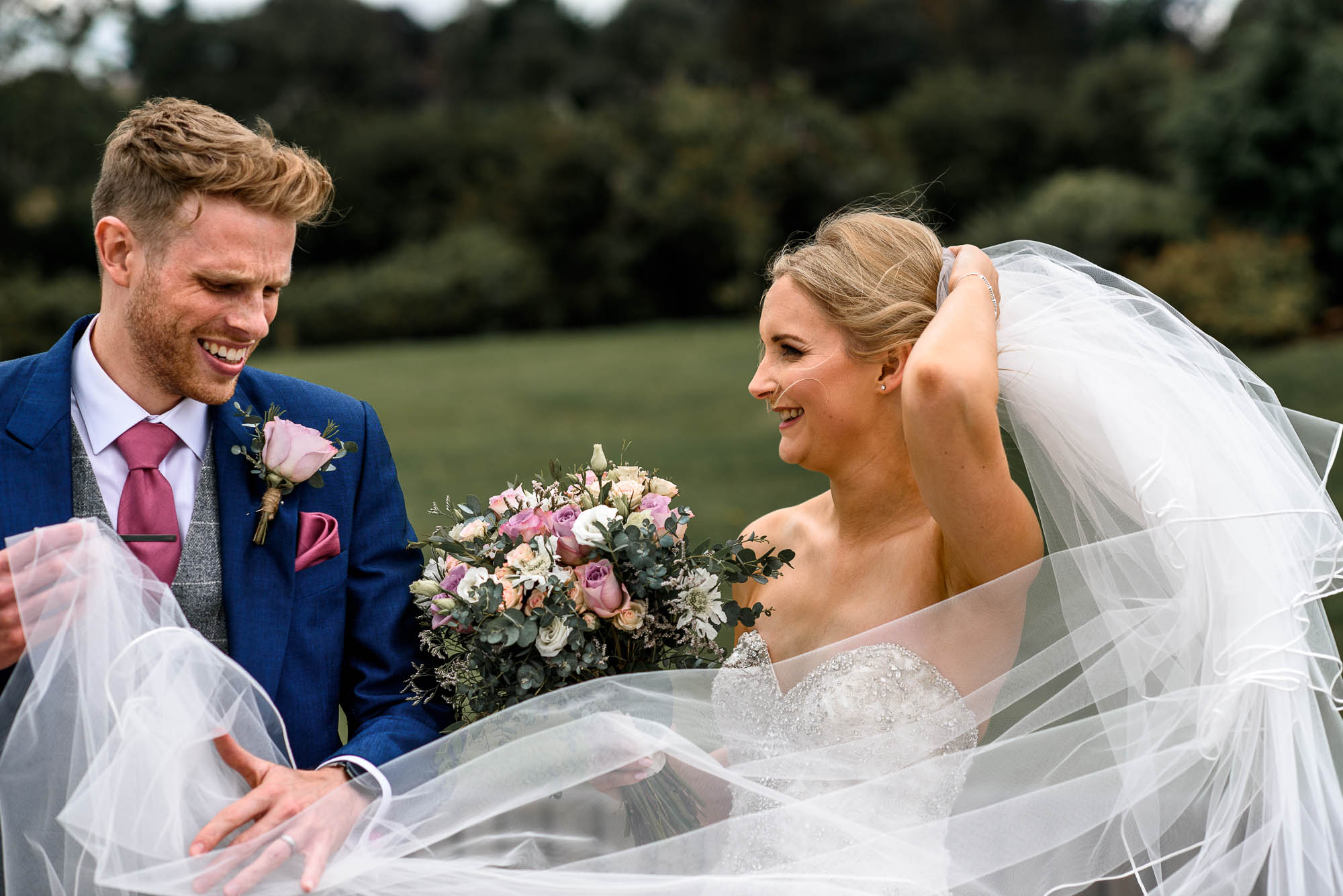 Candid moment with Brides veil catching the wind