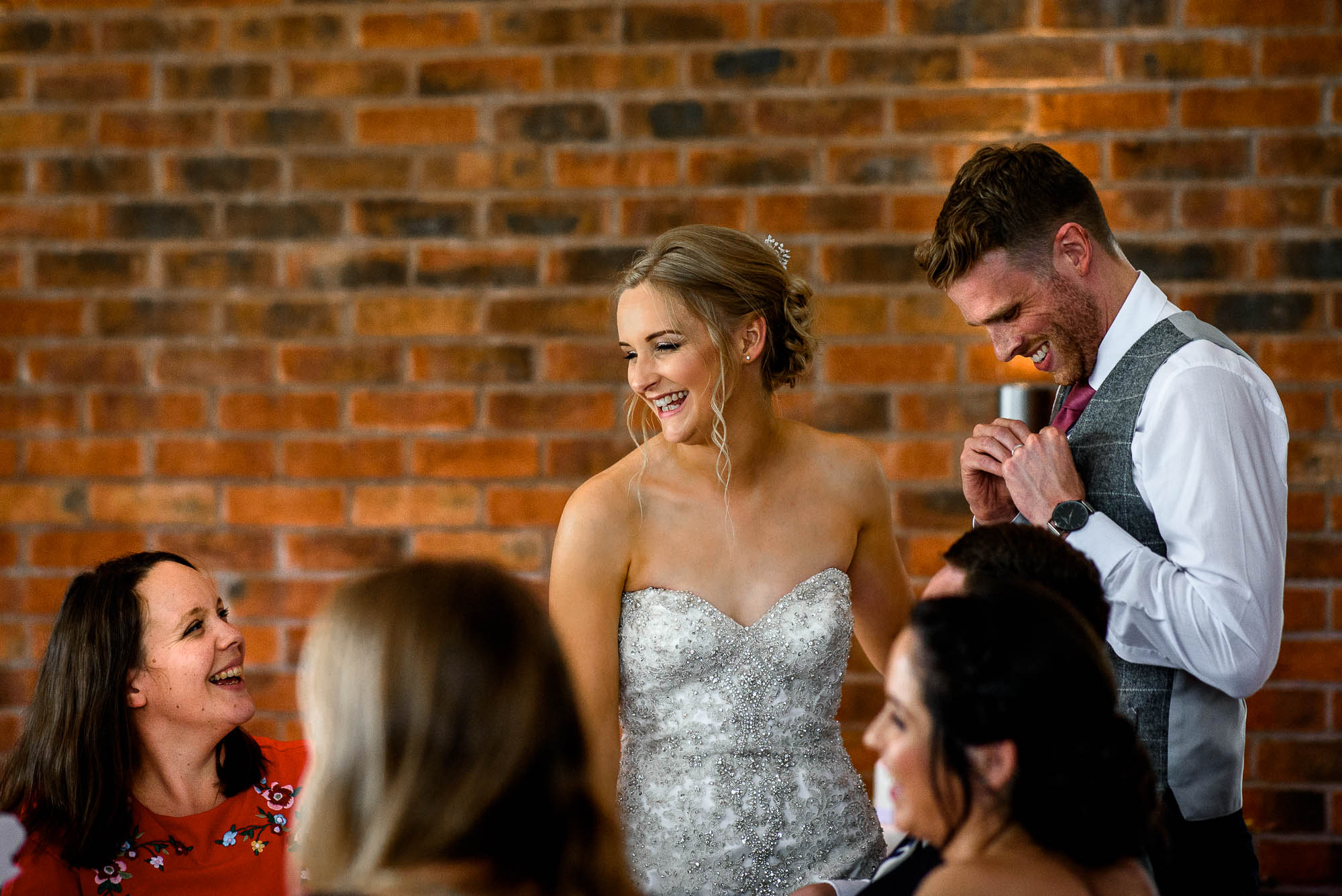 Bride and Groom talk to guests during wedding breakfast