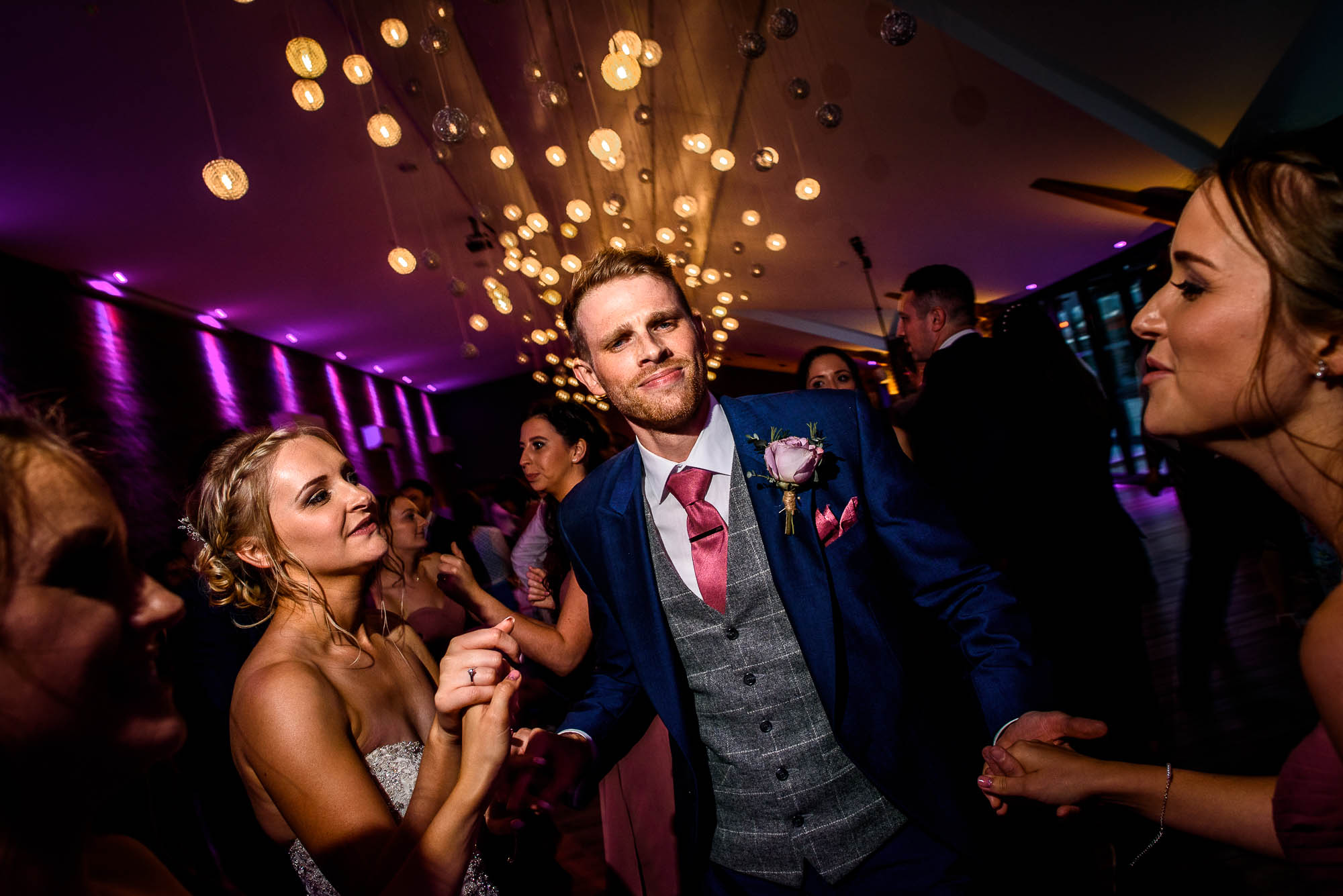 Groom throws some moves down on crowded dancefloor